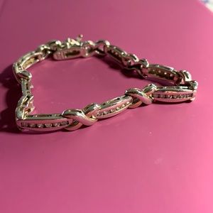 Sterling silver bracelet with CZ accents.